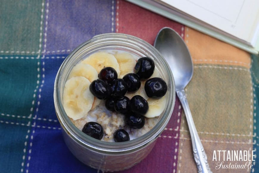 oatmeal in a jar with sliced bananas and blueberries