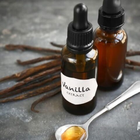 brown bottle of homemade vanilla with vanilla beans