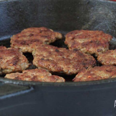 homemade sausage in a cast iron pan