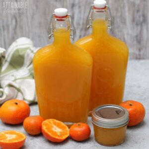 orange tangerine syrup in flip top bottles and a small canning jar