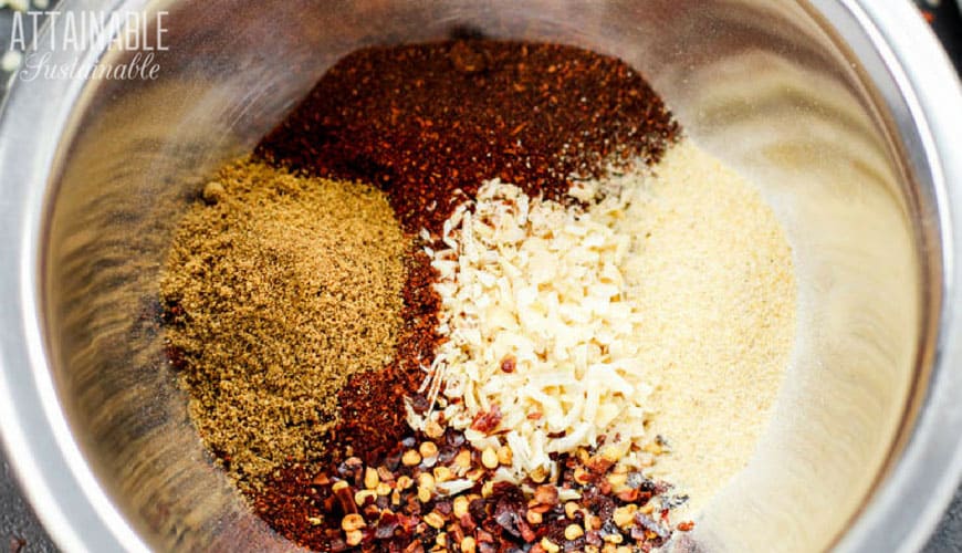 spices for homemade taco seasoning in a silver bowl