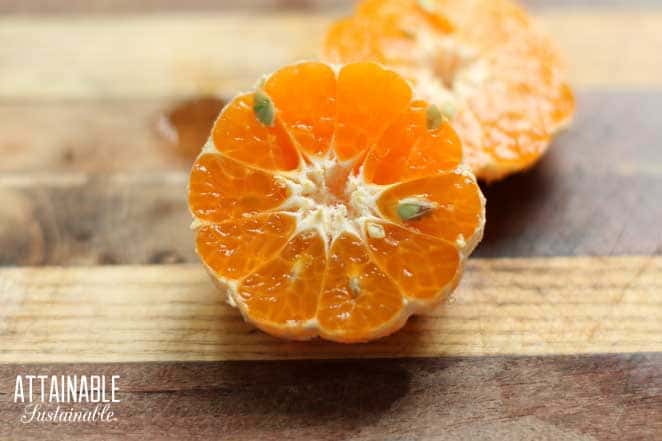 tangerine cut in half to reveal seeds
