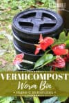 worm bin outside with red flowers