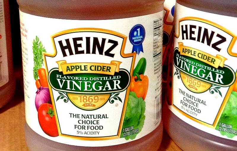 jugs of apple cider vinegar with labels