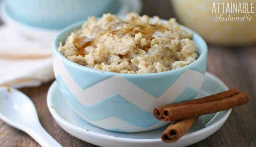 cooked oatmeal with cinnamon in a blue bowl is one of our favorite budget recipes