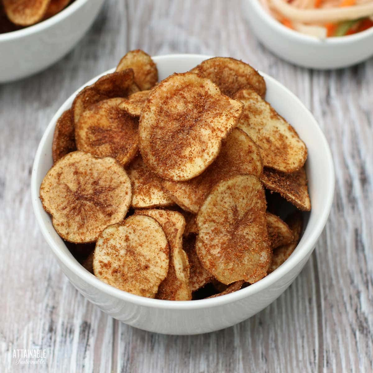 BBQ potato chips in a white bowl.