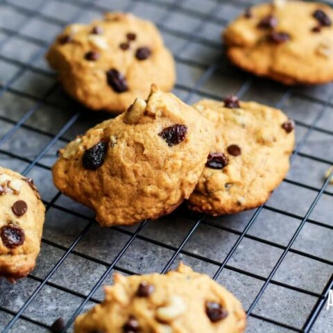 persimmon cookies with raisins and chocolate chips on a cooling rack