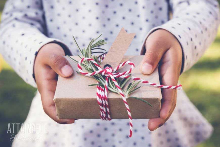 christmas gifts for kids, nicely wrapped and held by child's hands