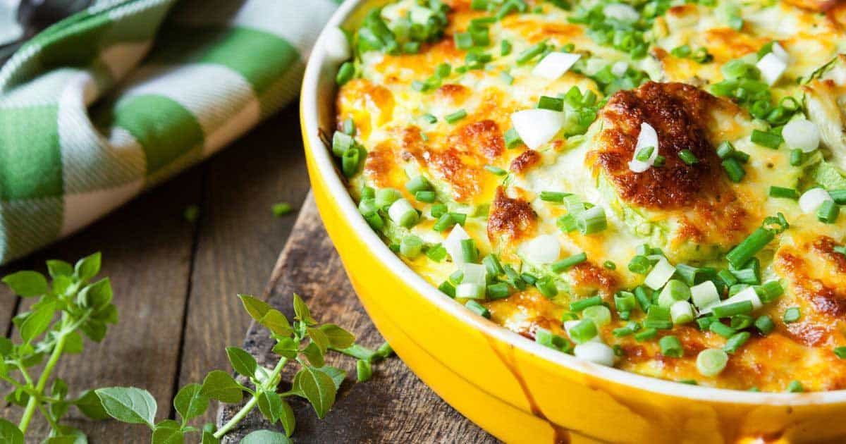 green onions on a cheesy leftover meal 