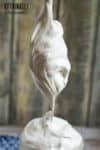marshmallow fluff on a vertical spoon
