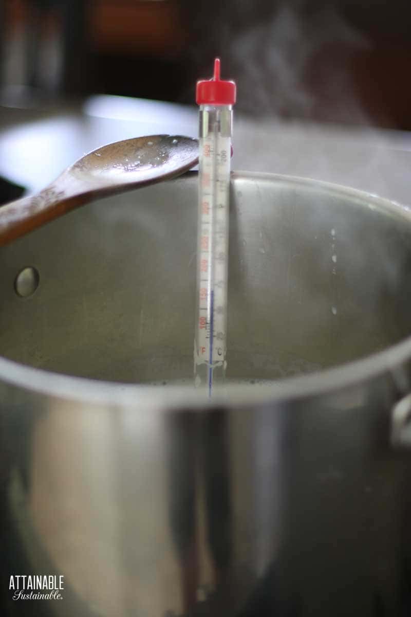 pot with a candy thermometer hanging on the side.