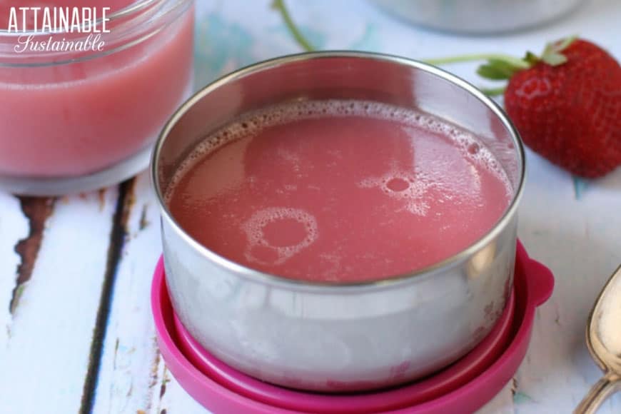 homemade jello (pink) in a stainless container