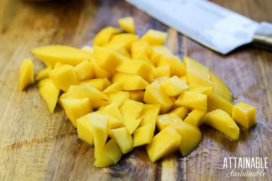 mango chunks on a cutting board