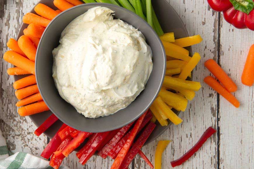 french onion dip in a bowl with fresh veggies