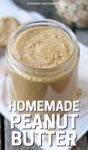 GLASS jar of homemade peanut butter.
