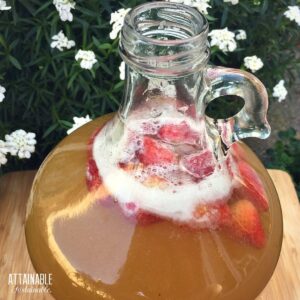 strawberry mead in a glass bottle.