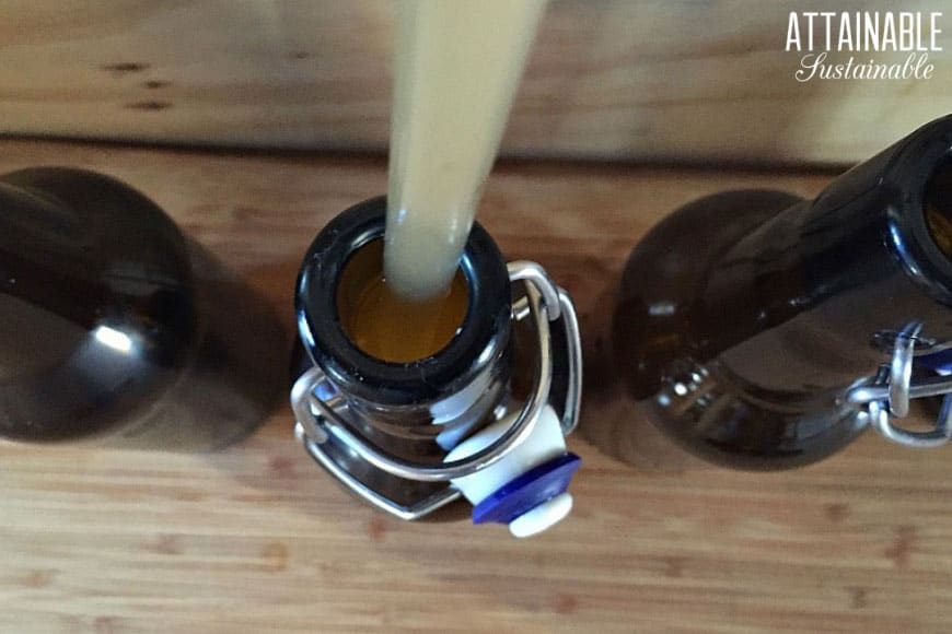 brown swing top bottles from above, bottling mead