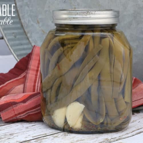 dilly green beans in a glass jar