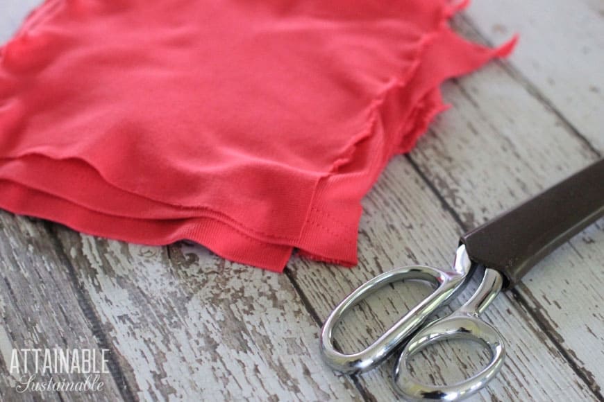 pink tshirt fabric torn into squares to make homemade dryer sheets