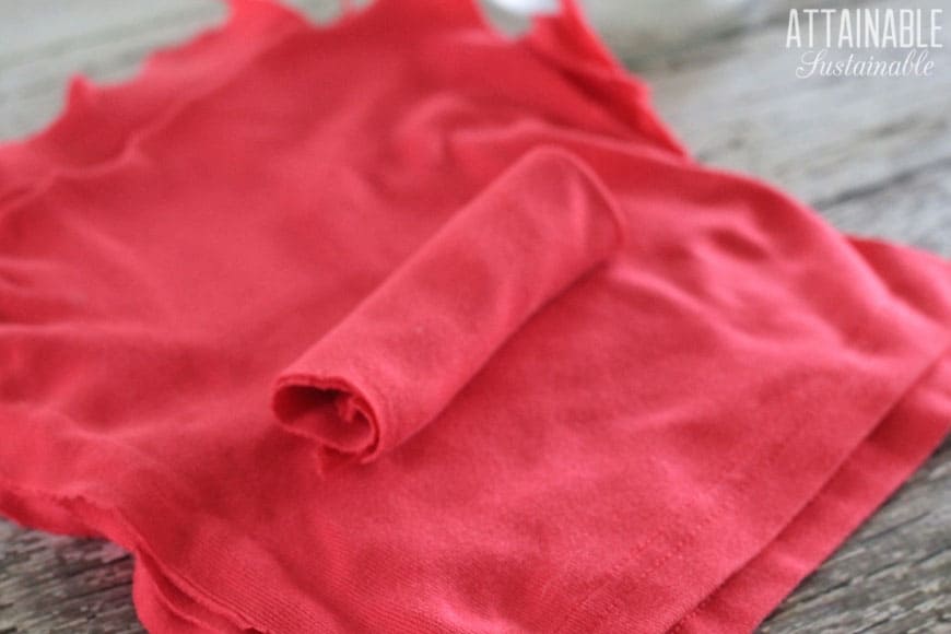 pink tshirt fabric torn into squares to make homemade dryer sheets