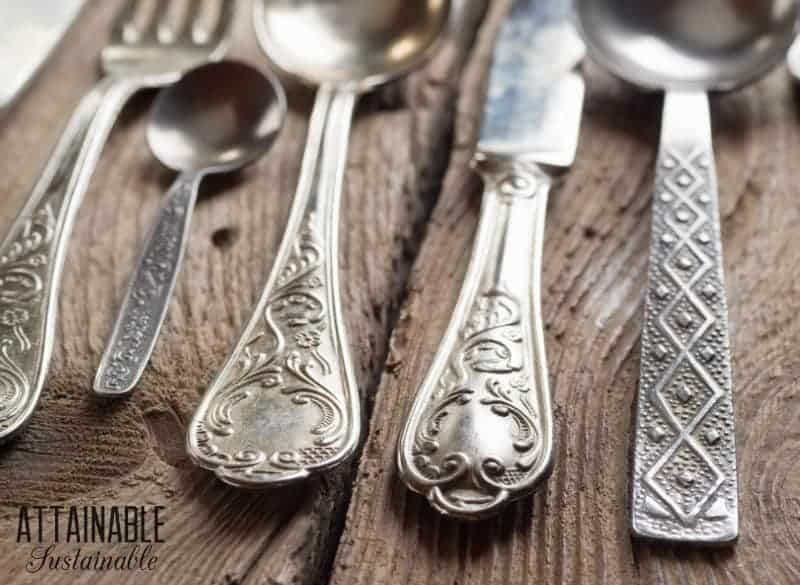 close up of silverware on a wooden table