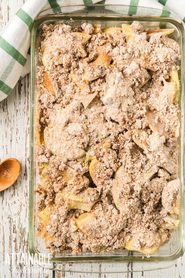 uncooked apple cobbler in a baking dish.