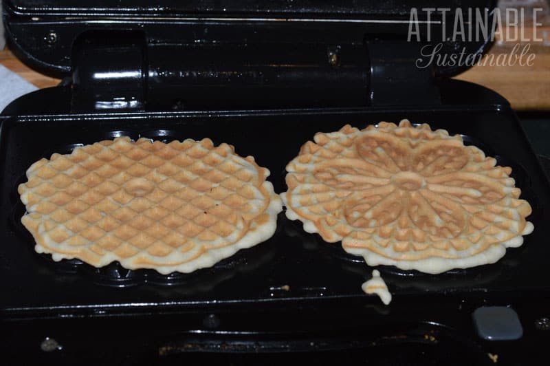 cooked pizzelles in pizzelle maker