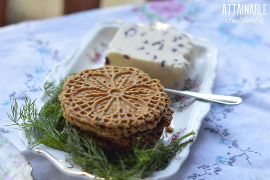 pizzelle recipe made and plated on a floral plate with cheese