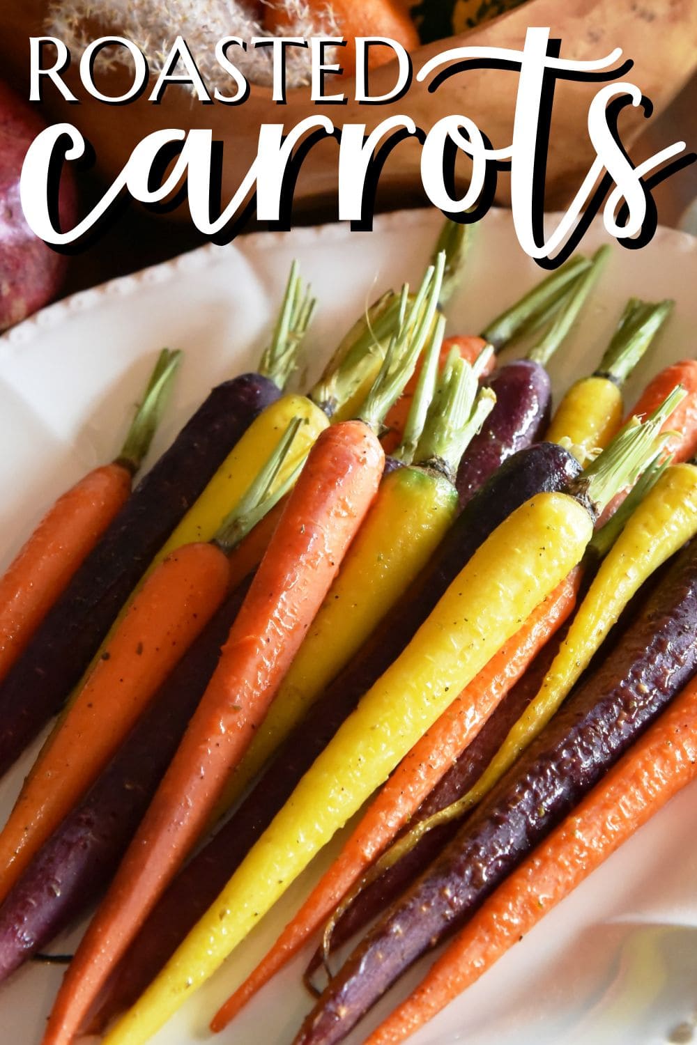 white platter with colorful roasted carrots.