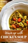 healthy chicken noodle soup in a white bowl