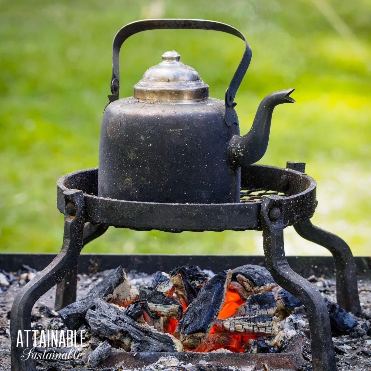 vintage tea pot over a wood fire.