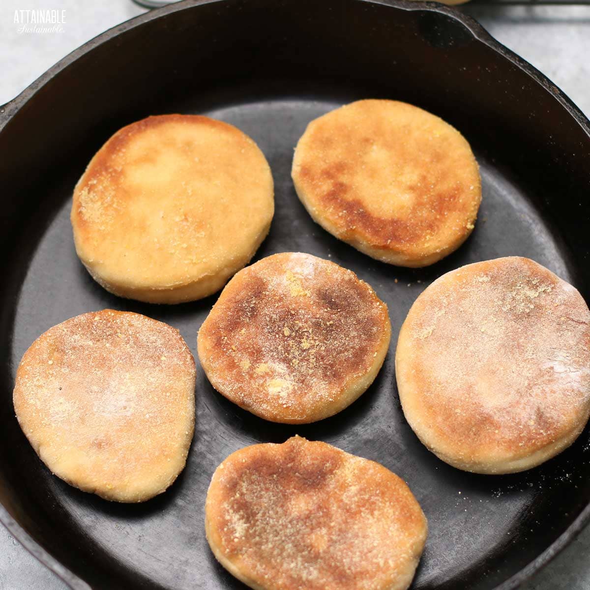 browned english muffins in a cast iron skillet. 