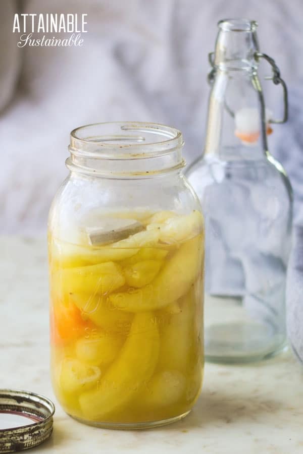 fermented banana peppers in a glass jar