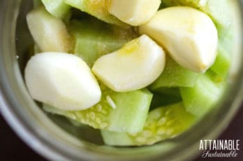 cucumber slices and garlic in a jar