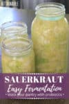three glass jars full of homemade sauerkraut recipe (green cabbage)