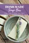 homemade soap in a pale green pottery dish with lavender flower