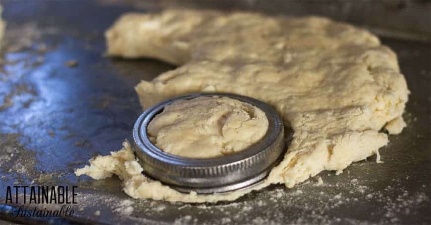 cutting buttermilk biscuit dough with a canning jar ring