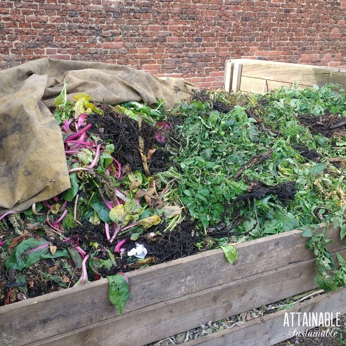 overfull composter with greens visible.