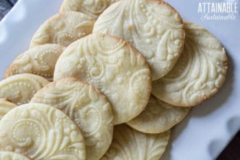 homemade sugar cookies on a white platter.