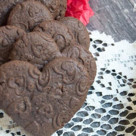 heart chocolate sugar cookies on a doily