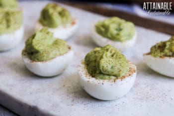 Deviled eggs with green avocado filling