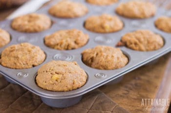 sourdough banana nut muffins in a muffin tin