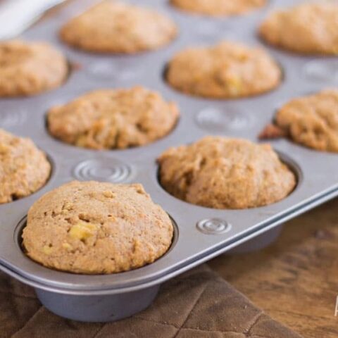 sourdough banana nut muffins in a muffin tin