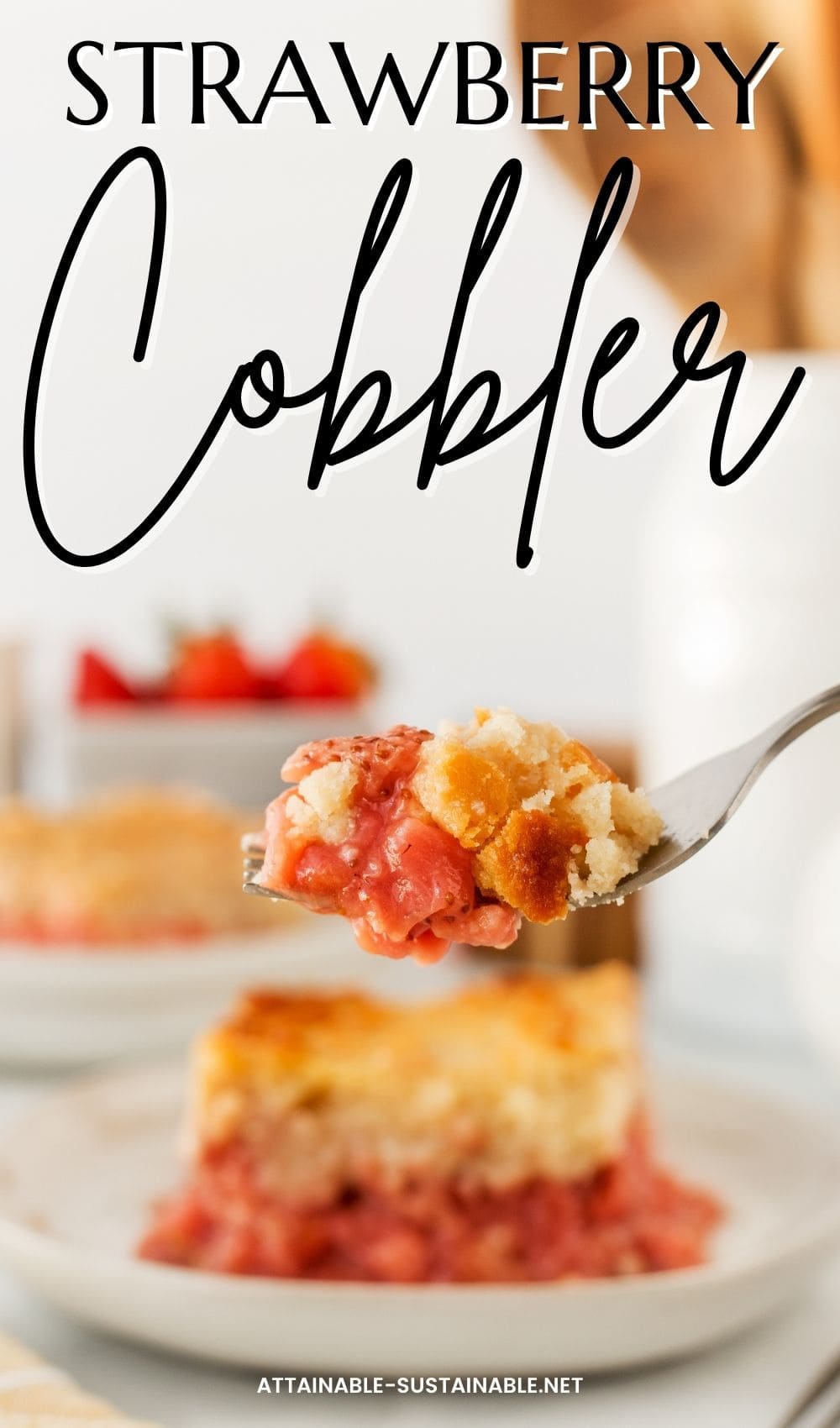 fork with a bite of cobbler, plate with dessert in the background