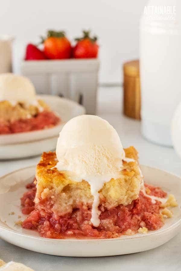 strawberry dessert with scoop of ice cream on a white plate