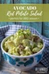red potato salad in a white bowl with blue and teal paisley