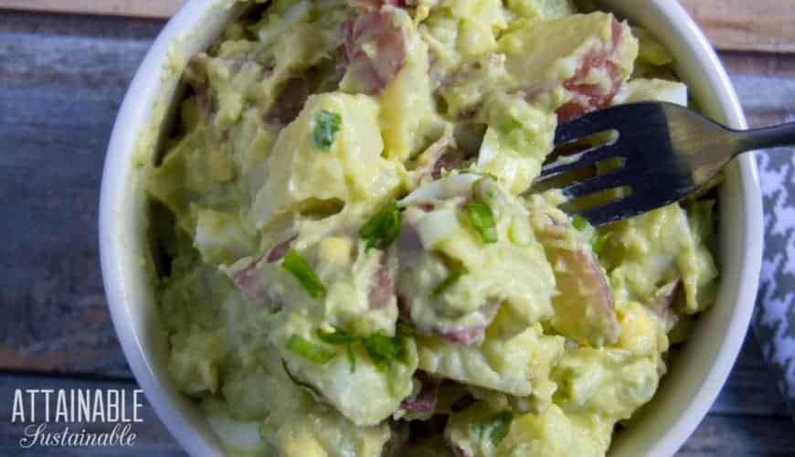 red potato salad in a bowl with a fork, from overhead