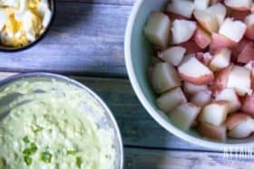 ingredients for red potato salad in bowls