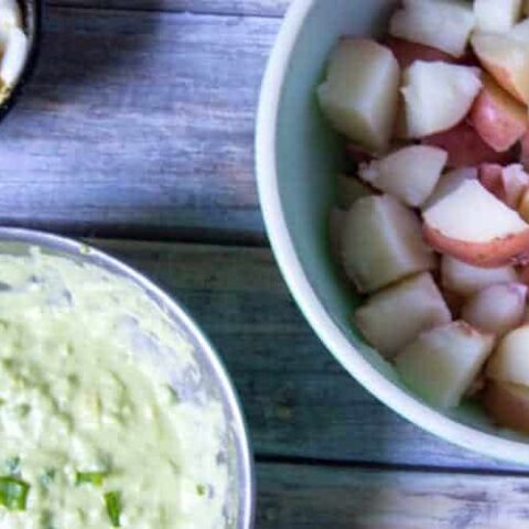 ingredients for red potato salad in bowls