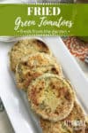 easy fried green tomato recipe finished and served on a white rectangular plate